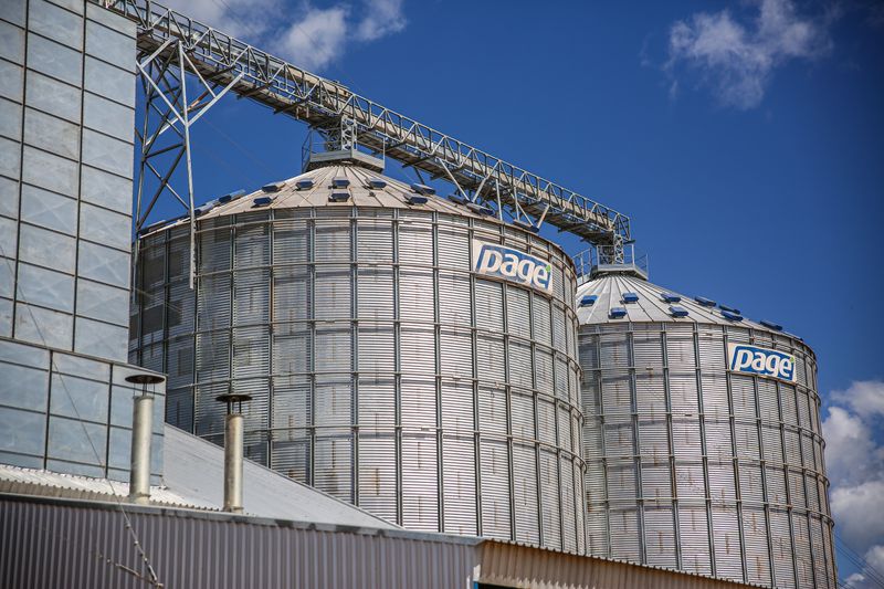 Industrial grain silos under blue sky